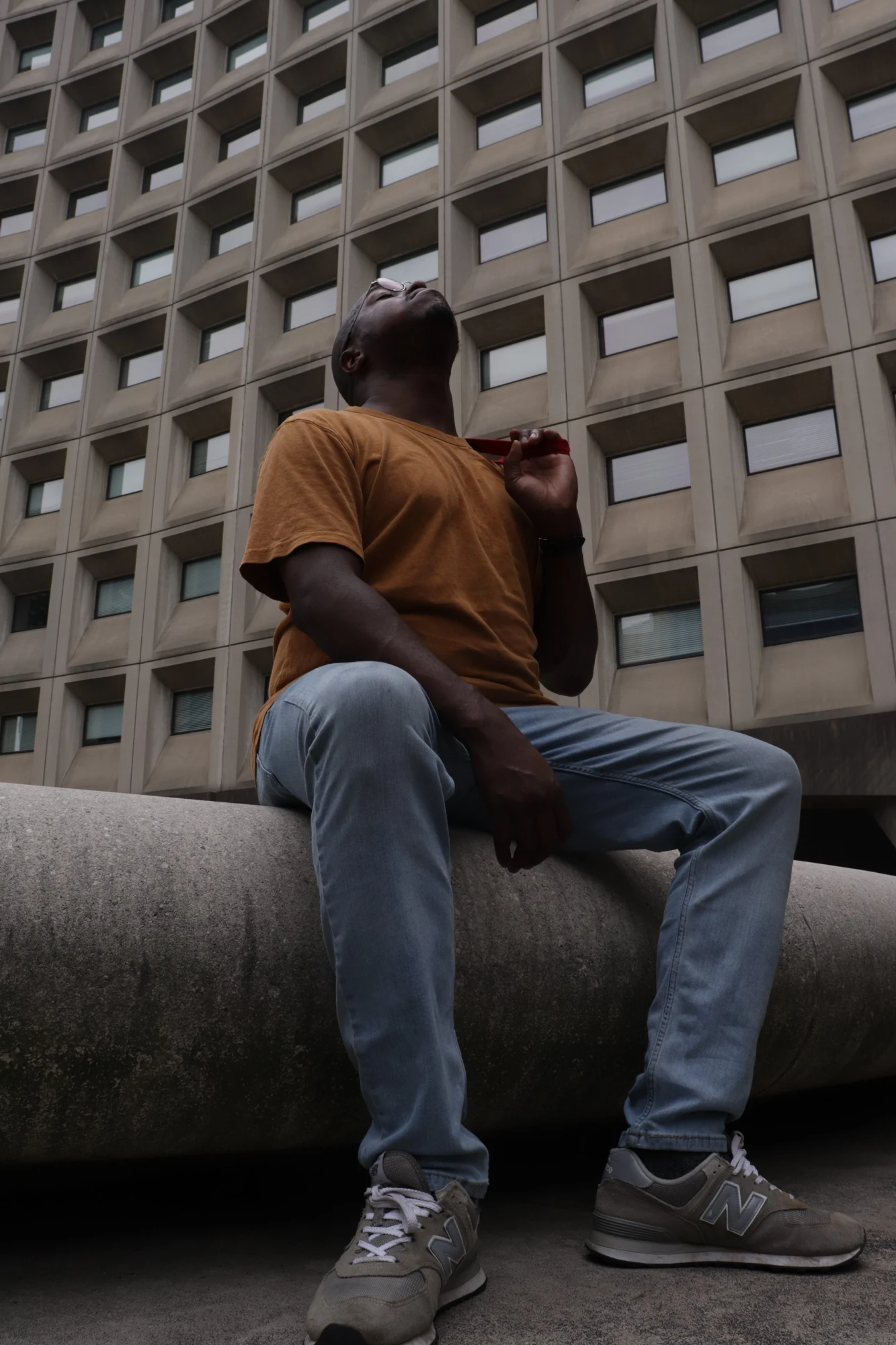 Foundation by Zian: a seated figure against a geometric building